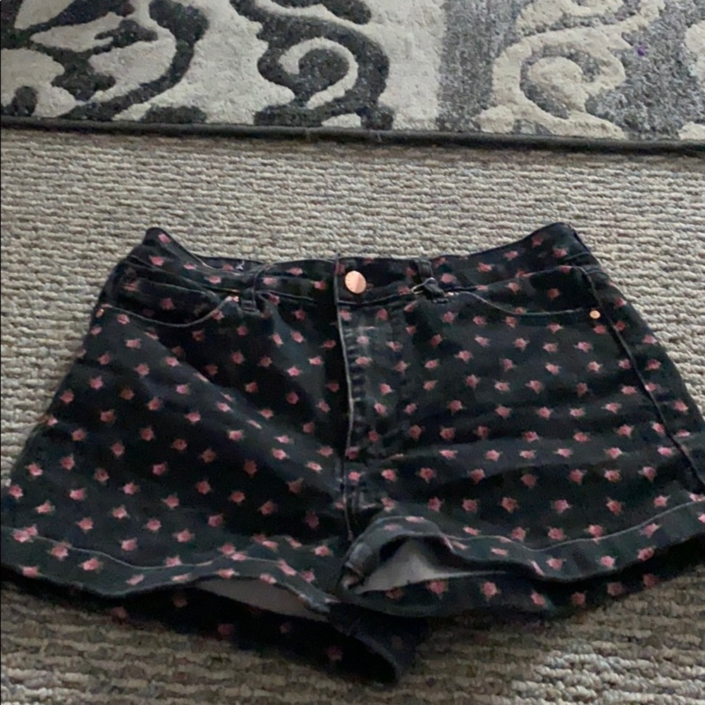 Black shorts with decorative roses.